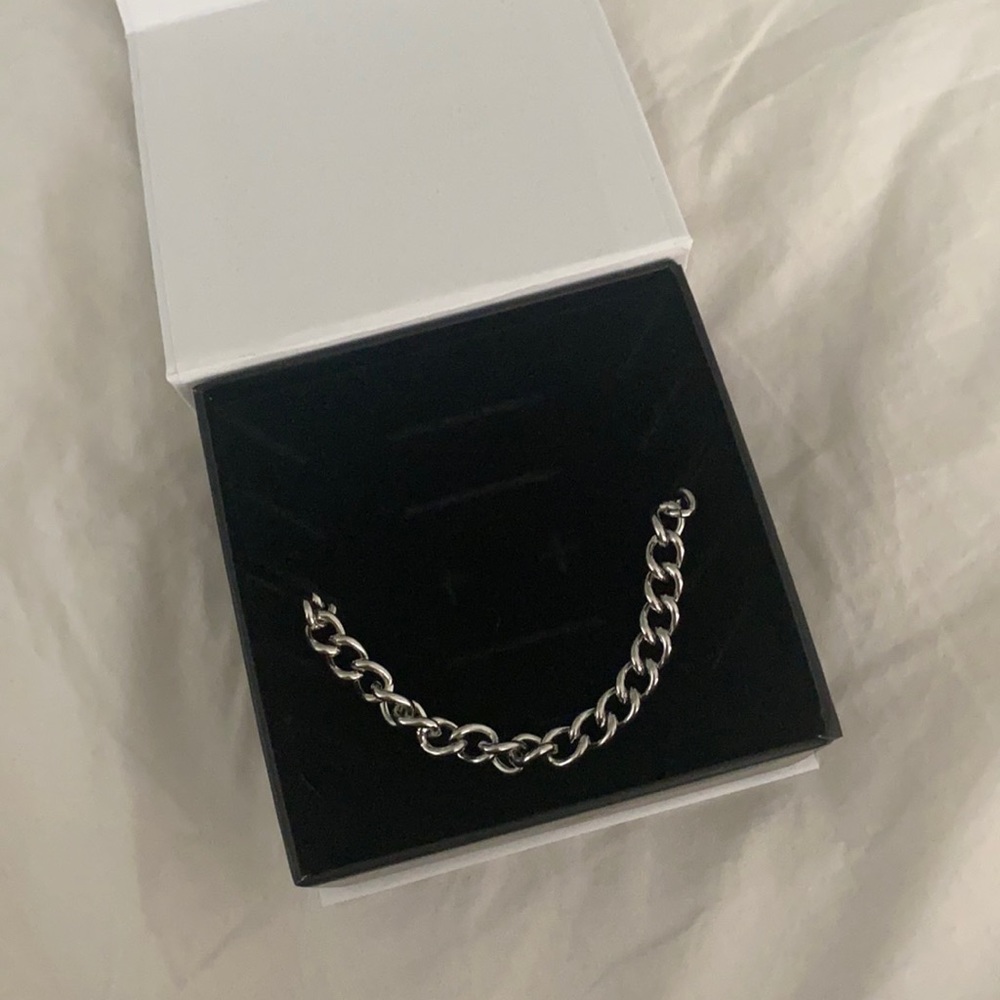 Not used, brand new from VibeSzn. Silver. 17”